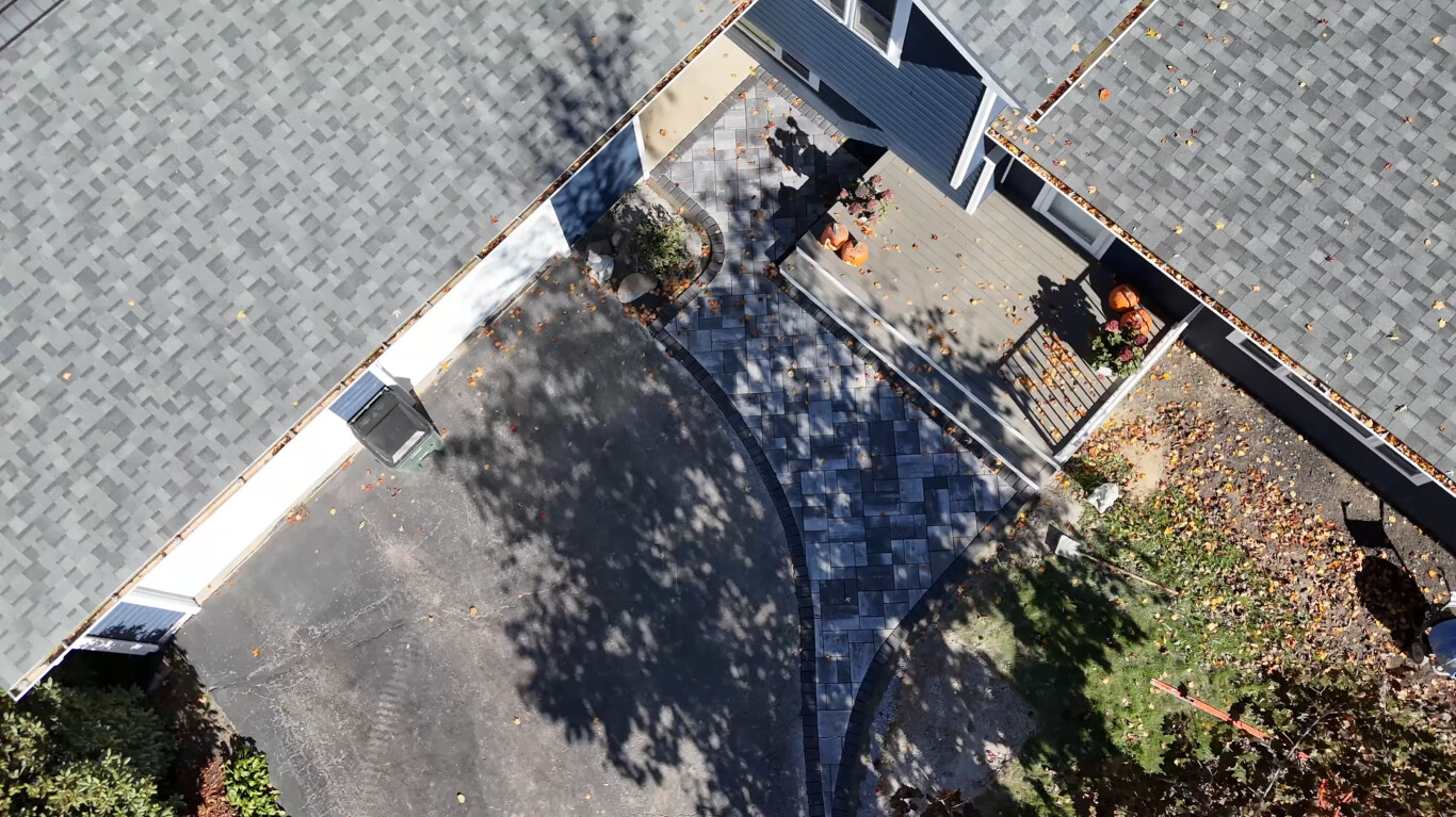 Aerial view of professionally installed concrete driveway and walkway in Lynwood, CA